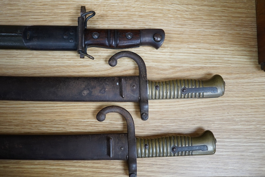 Two 19th century French bayonets and an American example, largest 71cm. Condition - fair